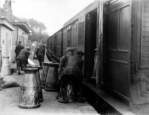 Loading milkchurns at Selham station 1923